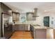 Well-appointed kitchen with gray cabinetry, granite counters, stainless appliances, and an open design at 2855 Briarlake Ne Rd, Atlanta, GA 30345