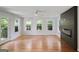 Bright living room boasting hardwood floors, a modern fireplace, and ample natural light from multiple windows at 2855 Briarlake Ne Rd, Atlanta, GA 30345