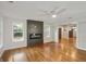 Open living area with hardwood floors, a modern fireplace feature, and seamless flow to adjacent rooms at 2855 Briarlake Ne Rd, Atlanta, GA 30345