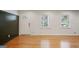 Inviting living room featuring beautiful hardwood floors, a stylish entry door, and neutral wall colors at 2855 Briarlake Ne Rd, Atlanta, GA 30345