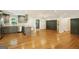 Spacious open floor plan connecting the kitchen, dining, and living areas, with gleaming hardwood floors at 2855 Briarlake Ne Rd, Atlanta, GA 30345