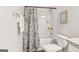 Bathroom with a tub and shower, a toilet, and stylish shower curtain at 179 Stanchion Dr, Union City, GA 30291