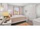 Cozy bedroom with a soft bed, bright window, and stylish decor at 179 Stanchion Dr, Union City, GA 30291
