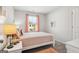Cozy bedroom with a soft bed, bright window, and stylish decor at 179 Stanchion Dr, Union City, GA 30291