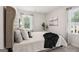 Bedroom features a comfortable bed, large headboard, and natural light at 179 Stanchion Dr, Union City, GA 30291