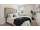 Bedroom features a comfortable bed, large headboard, and natural light at 179 Stanchion Dr, Union City, GA 30291