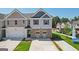 Charming two-story townhome with a single-car garage and well-maintained front lawn at 179 Stanchion Dr, Union City, GA 30291