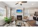 Inviting living space with a fireplace, contemporary furnishings, and an open floor plan at 179 Stanchion Dr, Union City, GA 30291