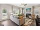 Cozy living room featuring a fireplace, plush seating, and natural light from the windows at 179 Stanchion Dr, Union City, GA 30291