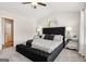 Well-lit main bedroom featuring a padded headboard and accent furniture at 179 Stanchion Dr, Union City, GA 30291