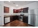 This kitchen features stainless steel appliances, granite countertops, and hardwood floors at 3155 Tarian Way, Decatur, GA 30034
