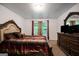 Comfortable bedroom featuring a large window and classic decor at 3155 Tarian Way, Decatur, GA 30034