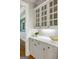 Convenient butler's pantry featuring white cabinets, quartz countertop, and sophisticated design at 125 Franklin Pl, Atlanta, GA 30342