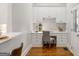 Bright home office area with white cabinetry, built-in desk, and hardwood floors at 125 Franklin Pl, Atlanta, GA 30342