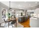 Bright, open kitchen with hardwood floors, gray island, stainless steel appliances, and ample natural light at 125 Franklin Pl, Atlanta, GA 30342