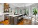 Open kitchen with island, stool seating, and bright breakfast nook at 125 Franklin Pl, Atlanta, GA 30342