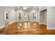 Bright living room with hardwood floors and french doors that lead to the backyard at 125 Franklin Pl, Atlanta, GA 30342