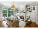 Cozy living room with fireplace, built-in shelves, large windows, and comfortable seating at 125 Franklin Pl, Atlanta, GA 30342