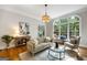 Bright living room with large windows, comfortable seating, and stylish decor at 125 Franklin Pl, Atlanta, GA 30342