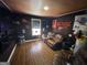 Finished bonus room with hardwood style floors and vintage furniture at 946 Creek Run Pl, Temple, GA 30179
