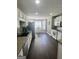 Bright kitchen with white cabinets, granite countertops, and stainless steel appliances at 946 Creek Run Pl, Temple, GA 30179