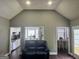 Bright living room with vaulted ceilings and seamless flow into the kitchen and dining areas at 946 Creek Run Pl, Temple, GA 30179