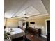Spacious main bedroom with a decorative ceiling, a ceiling fan, and a walk-in closet at 946 Creek Run Pl, Temple, GA 30179