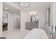 Bright bathroom with stand alone tub, glass shower, large windows with wooded views, and granite counters at 145 Mount Shasta Ln, Johns Creek, GA 30022