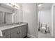 Bathroom with granite countertops, modern fixtures, and ample storage space at 145 Mount Shasta Ln, Johns Creek, GA 30022