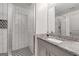 Modern bathroom with glass-enclosed shower, designer tile, and granite countertop vanity at 145 Mount Shasta Ln, Johns Creek, GA 30022