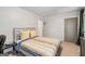 Neutral bedroom featuring natural light, plush carpet, and a comfortable bed at 145 Mount Shasta Ln, Johns Creek, GA 30022