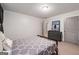 Cozy bedroom featuring natural light, plush carpet, and a comfortable bed at 145 Mount Shasta Ln, Johns Creek, GA 30022