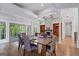 Dining room boasts hardwood floors, a chandelier, and access to other rooms at 145 Mount Shasta Ln, Johns Creek, GA 30022