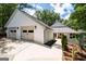 Beautiful home exterior with a two-car garage, manicured landscaping, and a charming pathway at 145 Mount Shasta Ln, Johns Creek, GA 30022