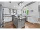 Well-lit kitchen features a center island, stainless steel appliances, and a subway tile backsplash at 145 Mount Shasta Ln, Johns Creek, GA 30022