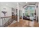 Spacious living room with hardwood floors, high ceilings, and large windows with natural light at 145 Mount Shasta Ln, Johns Creek, GA 30022