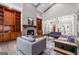 Spacious living room features built-in bookshelves, a fireplace, and neutral-toned furniture at 145 Mount Shasta Ln, Johns Creek, GA 30022