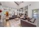Bright, open living room boasts high ceilings, neutral colors, and access to other rooms at 145 Mount Shasta Ln, Johns Creek, GA 30022