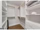 Well-organized walk-in closet features built-in shelving, drawers, and ample storage space at 145 Mount Shasta Ln, Johns Creek, GA 30022