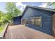 Exterior view of the wooden back deck, showcasing its spaciousness and access to the outdoors at 178 Castleair Ne Dr, Kennesaw, GA 30144