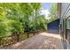 View of the wooden back deck with railings, perfect for outdoor relaxation and entertainment at 178 Castleair Ne Dr, Kennesaw, GA 30144