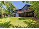 View of the backyard of the house from an angle, highlighting a deck and outdoor space at 178 Castleair Ne Dr, Kennesaw, GA 30144