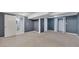 Large carpeted basement with access to a bathroom and closet at 178 Castleair Ne Dr, Kennesaw, GA 30144