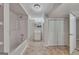 Basement bathroom with shower, tub, vanity, mirror, and closet at 178 Castleair Ne Dr, Kennesaw, GA 30144