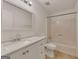 Bathroom featuring a white vanity, toilet, and shower/tub combination at 178 Castleair Ne Dr, Kennesaw, GA 30144