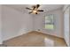 Bedroom with hardwood floors, a ceiling fan, and a bright window view at 178 Castleair Ne Dr, Kennesaw, GA 30144