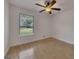 Bedroom with hardwood floors, a ceiling fan, and bright window overlooking a neighborhood at 178 Castleair Ne Dr, Kennesaw, GA 30144