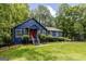 Lovely home with a well-manicured lawn, traditional architecture, and inviting covered front entry with stairs at 178 Castleair Ne Dr, Kennesaw, GA 30144