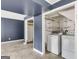 Functional laundry area with washer, dryer, and shelving in the basement with tile flooring at 178 Castleair Ne Dr, Kennesaw, GA 30144