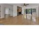 Bright living room with hardwood floors, stone fireplace, and sliding doors to the outside deck at 178 Castleair Ne Dr, Kennesaw, GA 30144